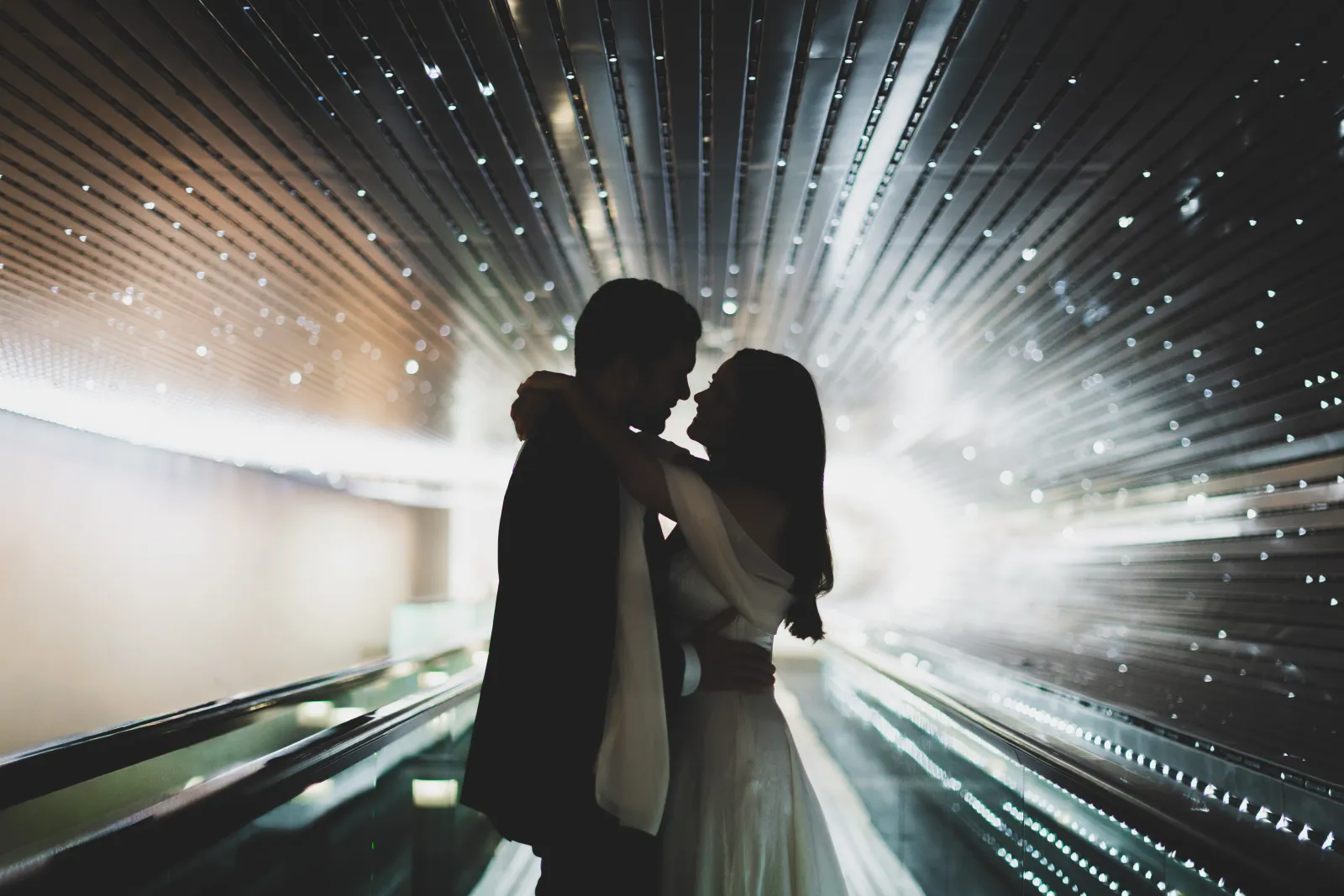 A quiet silhouette in the tunnel of lights