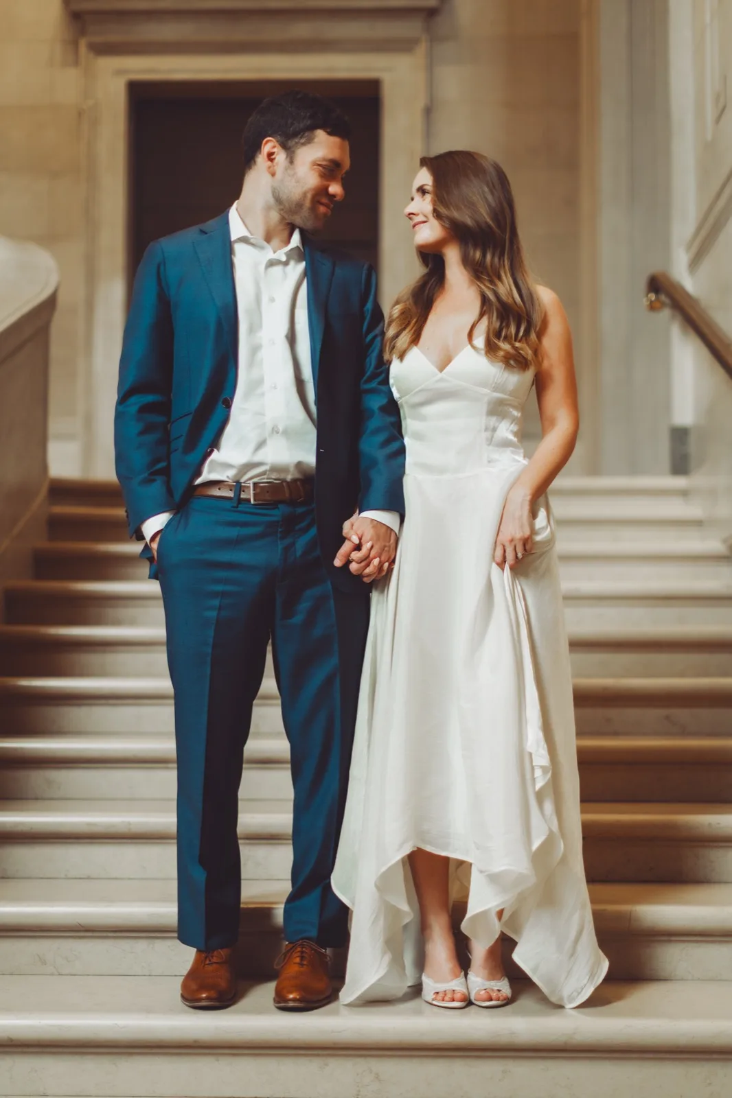 Hand in hand on the marble staircase of the National Gallery