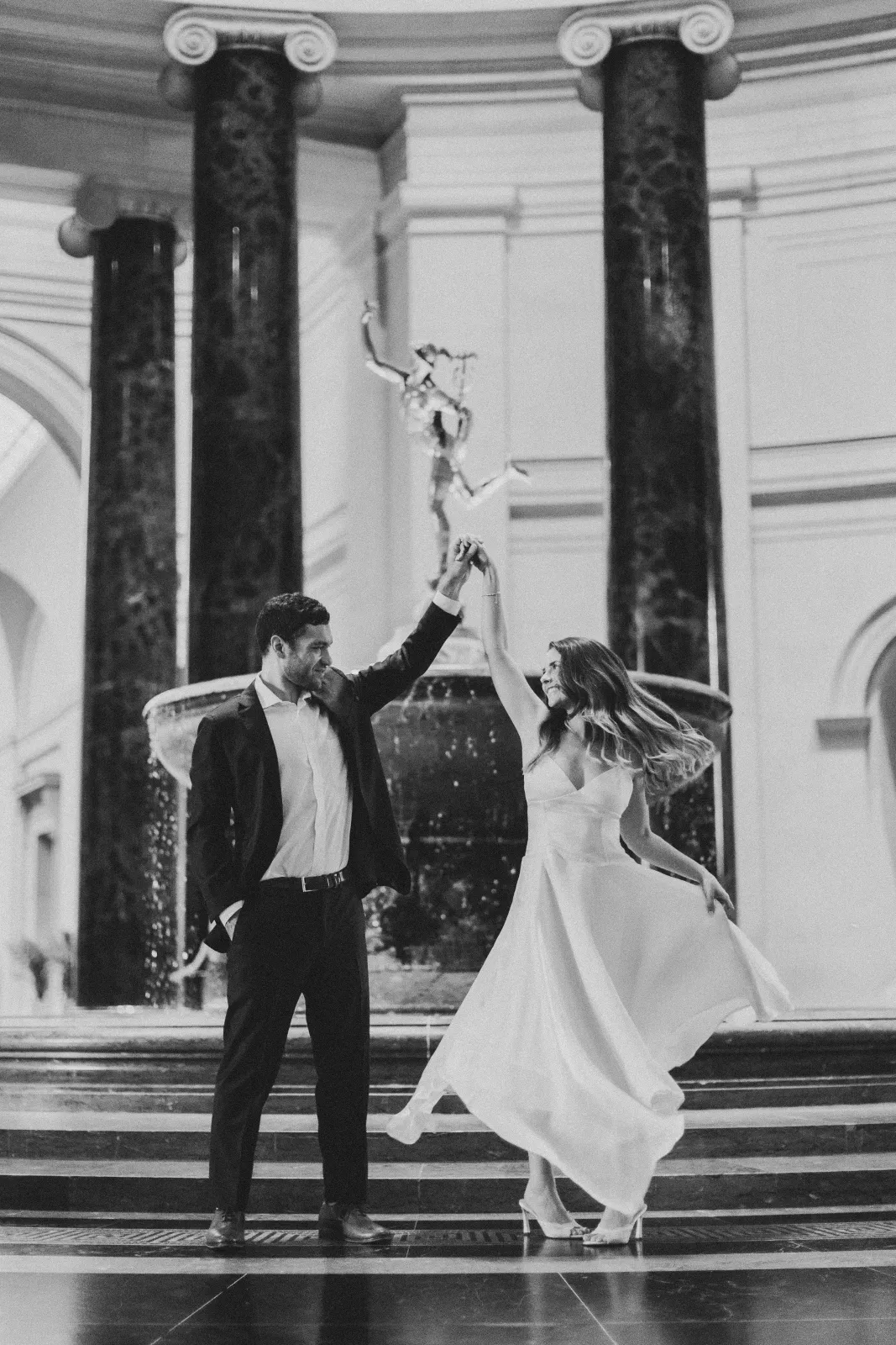 A twirl in front of the rotunda fountain, in black and white